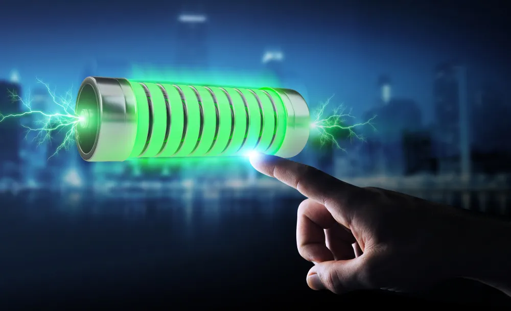 Businessman using green battery