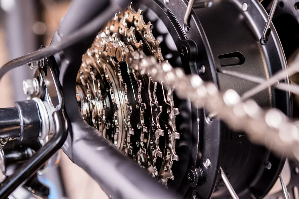 Glossy bicycle gear and black electric motor