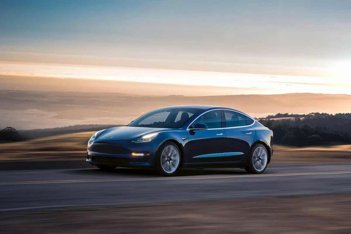 Vrg tesla model blue driving