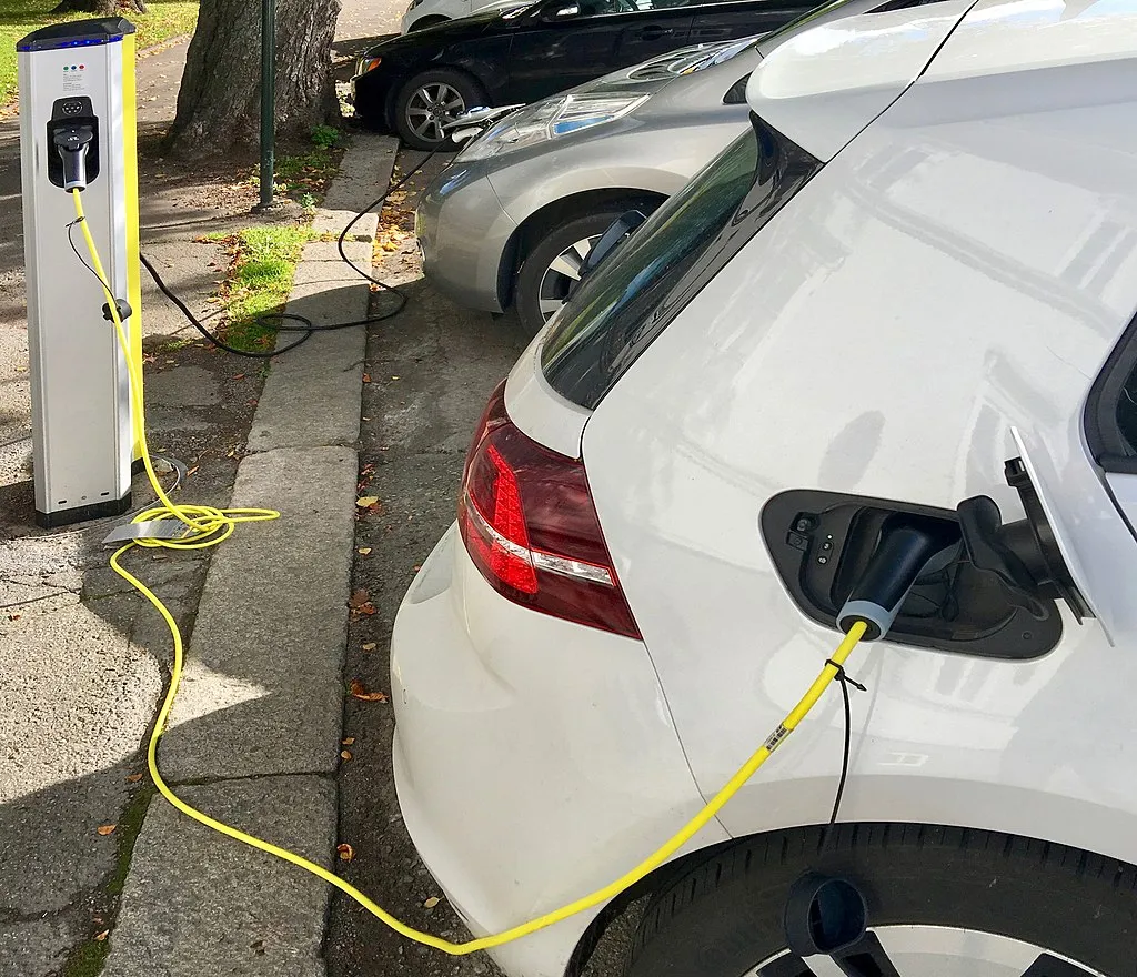 Electric car charging on the street