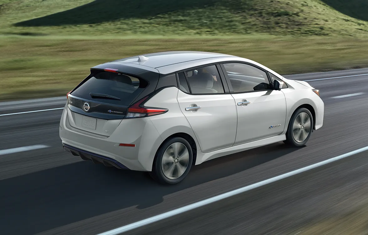 White Nissan Leaf Range running on a road