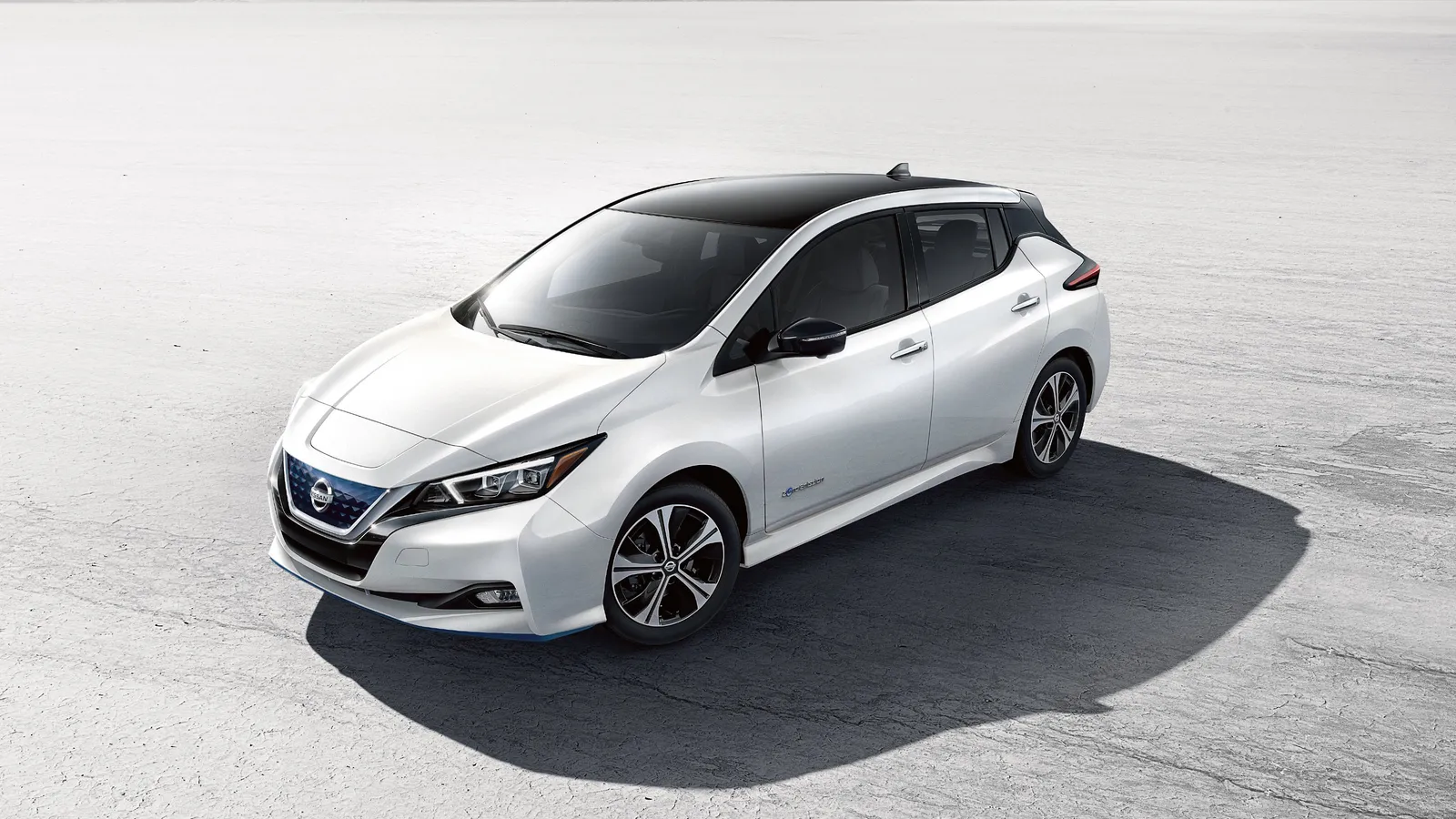 White Nissan Leaf Range parked