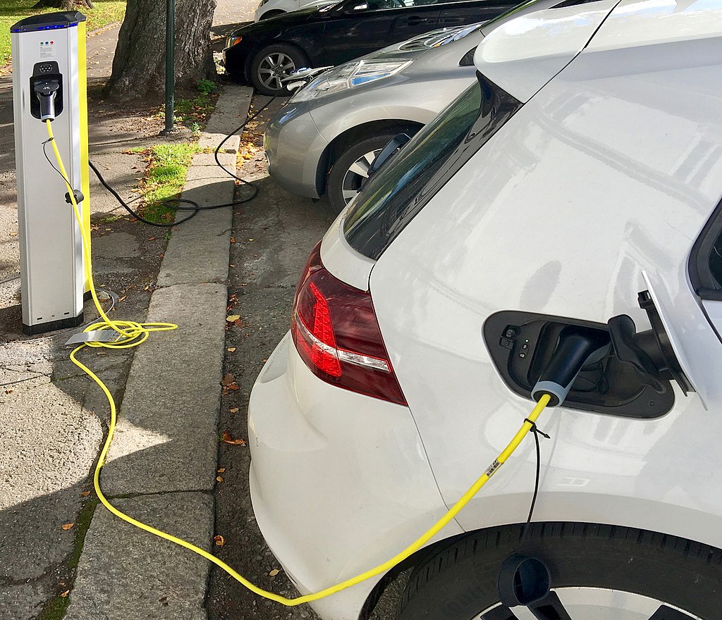 Electric car charging on the street